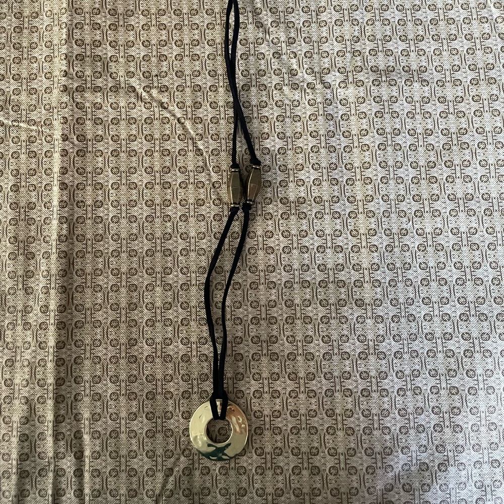 This is a gold ring necklace
